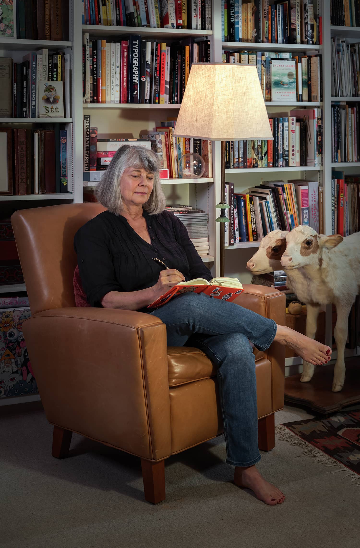 Marty Blake in sitting in her studio drawing in a sketchbook